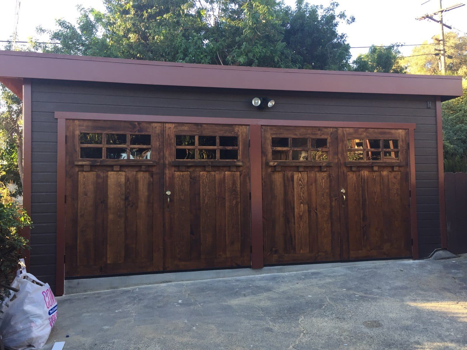 Stained wood garage door transforming a home's exterior