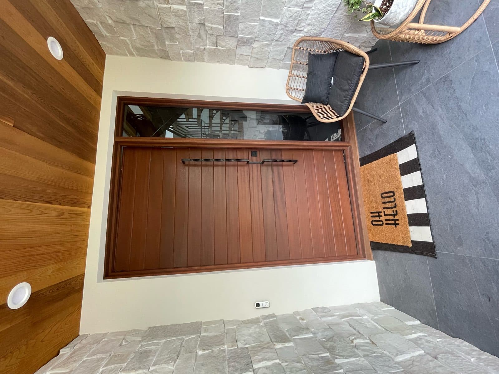 A hand-built Craft Doors USA custom wood garage door on a customer's home